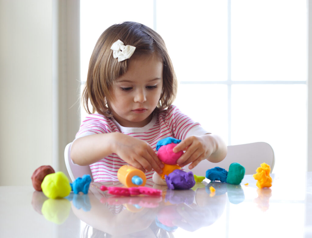 Little Girl Building Fine Motor Skills