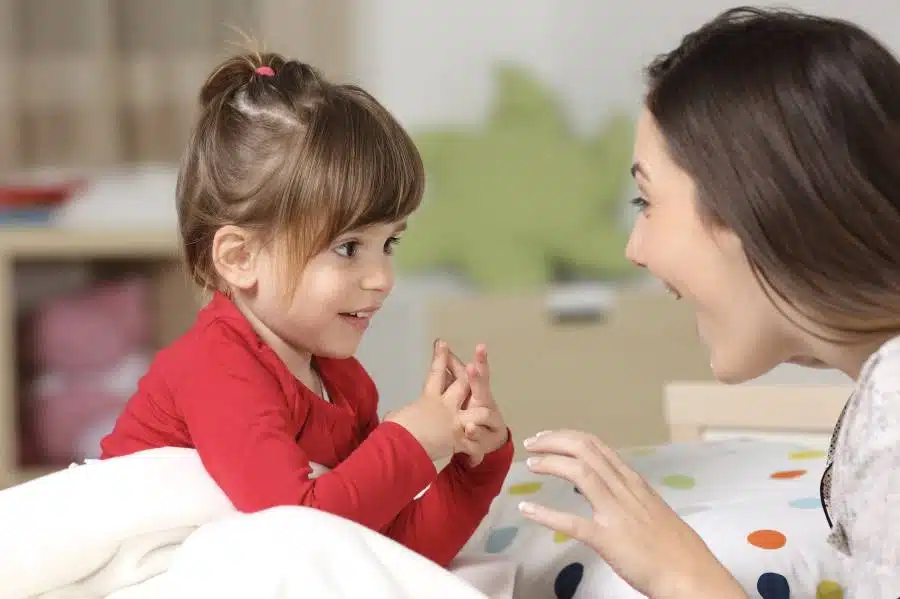 a mom talking to her child smiling at uplift therapy center