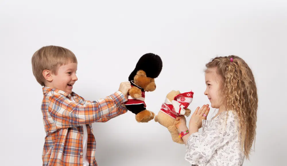 Kids playing with stuffed bears at a therapy session with uplift