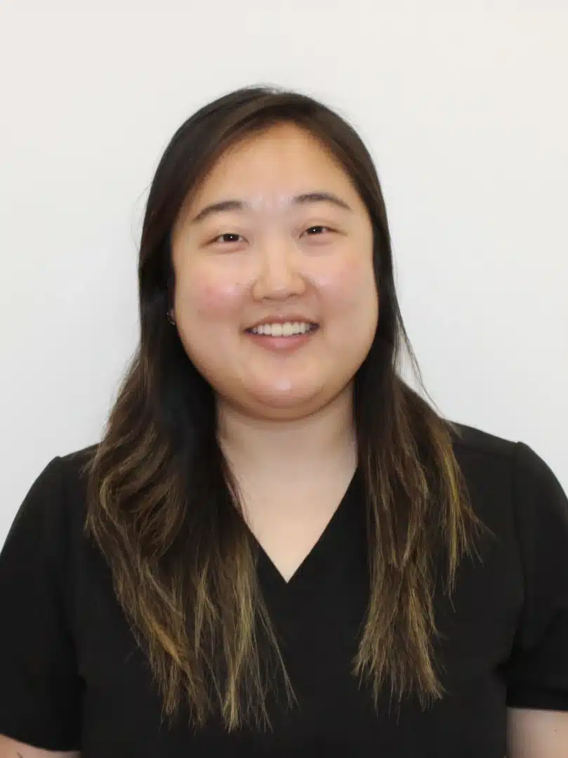 a photo of a woman smiling for a headshot